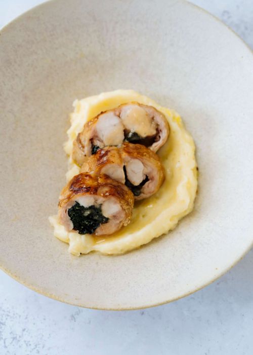 Stuffed rabbit with pecorino cheese & black cabbage on truffle pomme purée